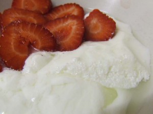 Junket raw milk pudding serving with strawberries 